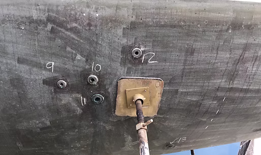 Yacht under construction with scaffolding